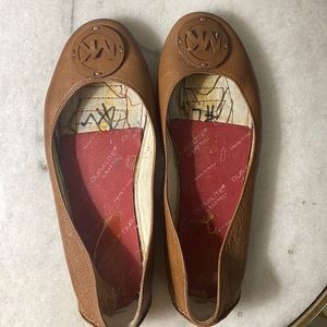 MK slippers worn